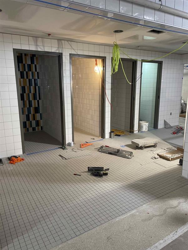 Inclusive restroom tile installation;